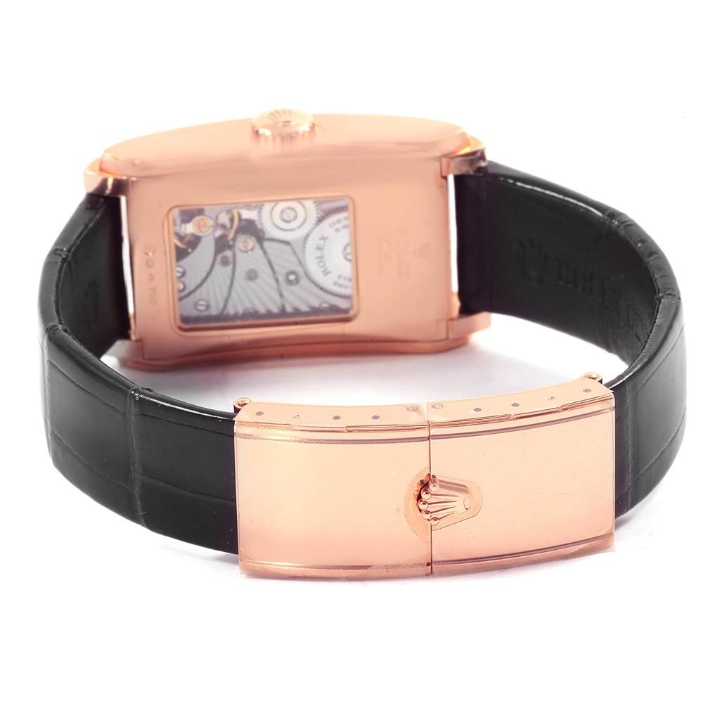 This image shows the back and clasp of a Rolex Cellini 5442/5 Men's Rose Gold Black Dial 5442/5 Men's Rose Gold Black Dial watch, highlighting its inner mechanisms and black leather strap.