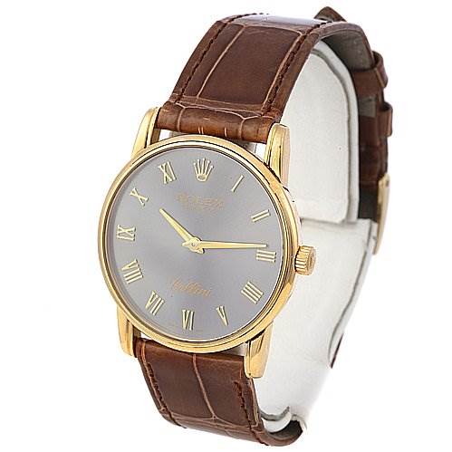 The image shows a Rolex Cellini 5116 Men's Yellow Gold Grey Dial 5116 Men's Yellow Gold Grey Dial watch angled from the front, highlighting its brown leather strap and gold case with Roman numerals.