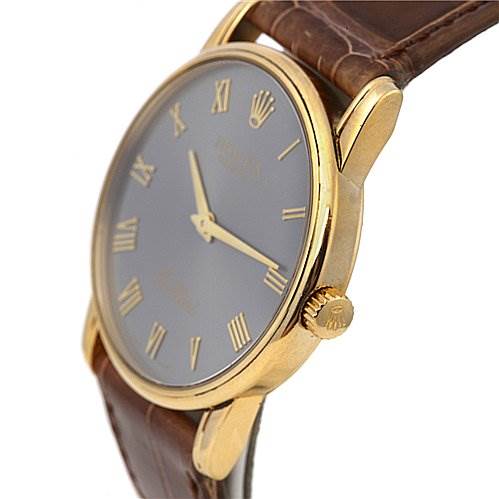 The image shows a side-angle view of the face, case, and crown of a Rolex Cellini 5116 Men's Yellow Gold Grey Dial 5116 Men's Yellow Gold Grey Dial watch with a brown leather strap.