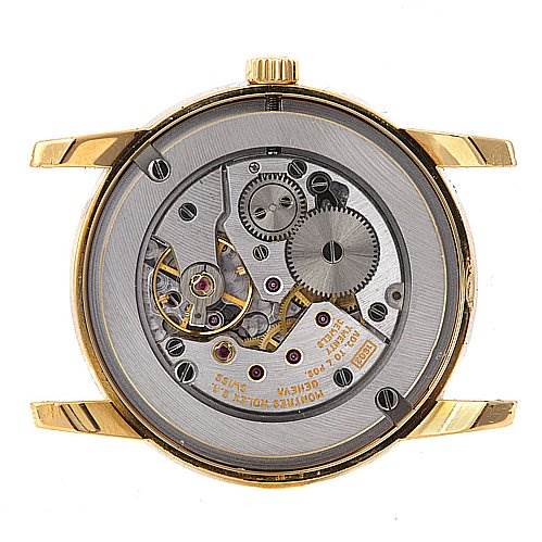 This image shows the back view of a Rolex Cellini 5116 Men's Yellow Gold Grey Dial 5116 Men's Yellow Gold Grey Dial watch, highlighting its internal mechanical movement.