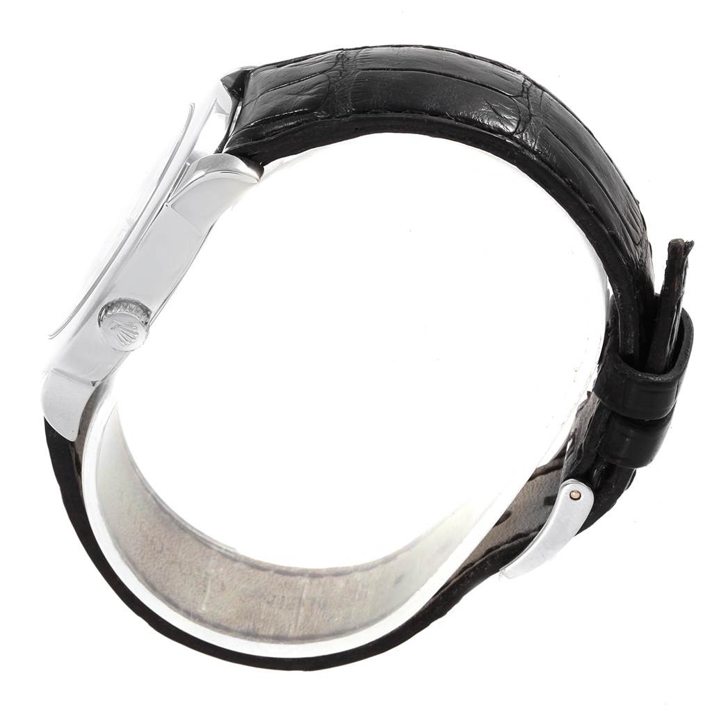 This image shows a side view of a Rolex Cellini 5240 Men's Platinum Mother of Pearl Dial 5240 Men's Platinum Mother of Pearl Dial watch, highlighting its case, crown, and leather strap.