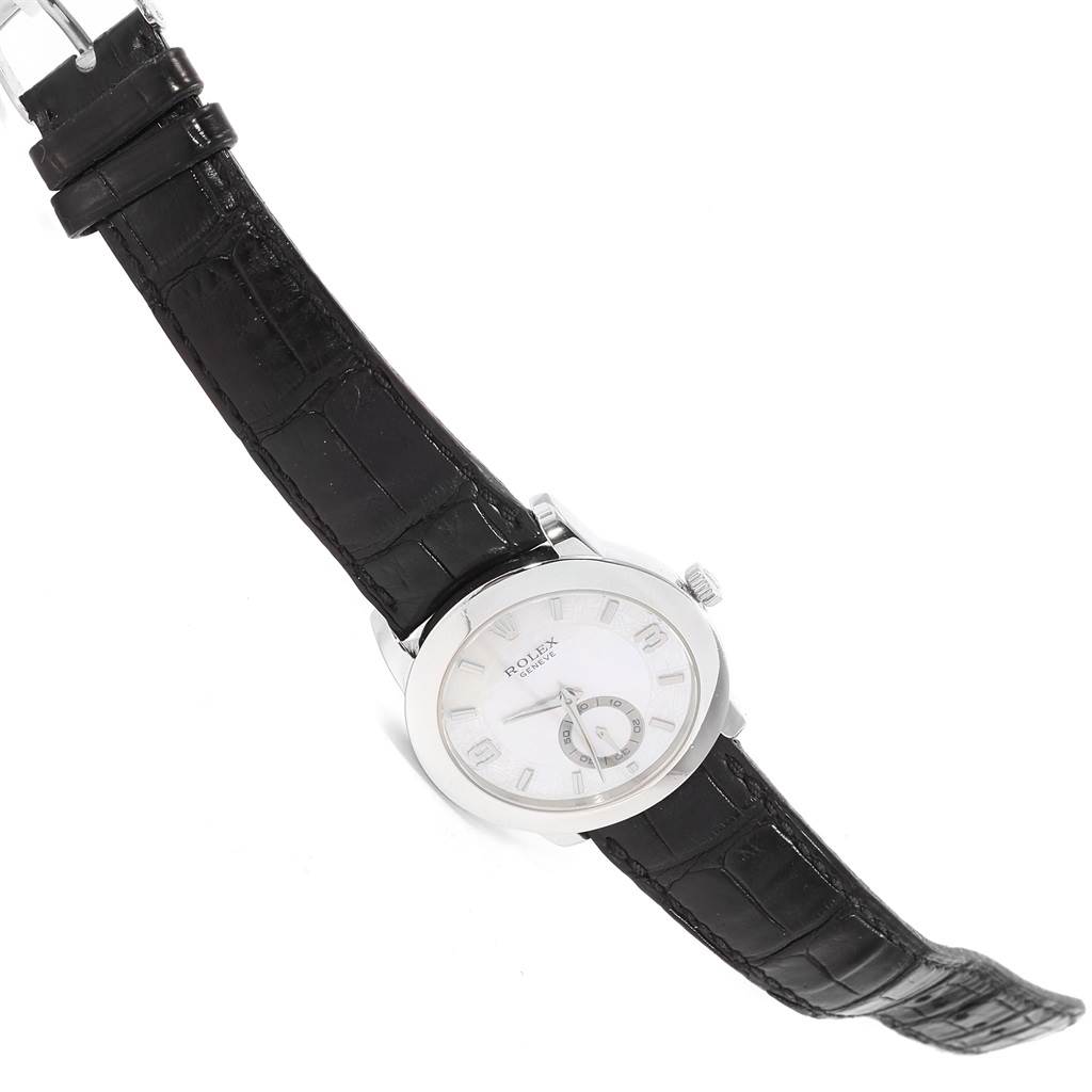 The Rolex Cellini 5240 Men's Platinum Mother of Pearl Dial 5240 Men's Platinum Mother of Pearl Dial watch is shown at a slight angle, highlighting its white dial, markers, crown, and black leather strap.
