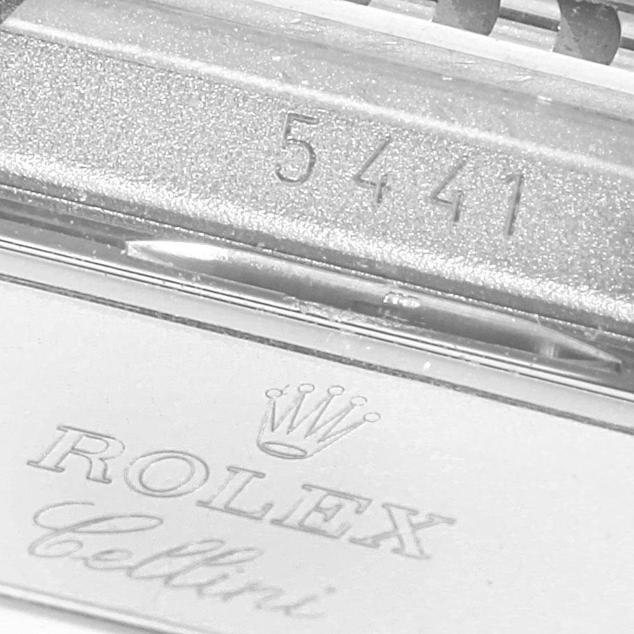 The image shows a close-up of the Rolex Cellini 5441/9 Men's White Gold Silver Dial 5441/9 Men's White Gold Silver Dial logo and part of the serial number.