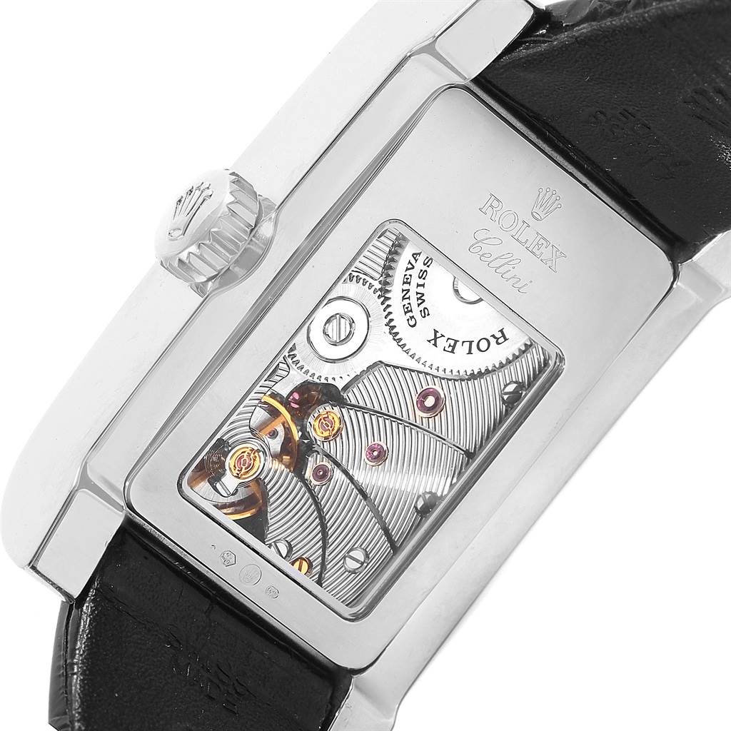 The image shows the back angle of a Rolex Cellini 5441/9 Men's White Gold Silver Dial 5441/9 Men's White Gold Silver Dial watch, showcasing its exposed mechanical movement and part of the leather strap.