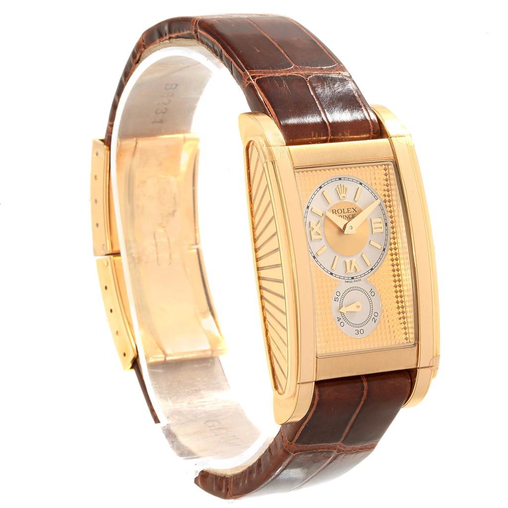 This image shows a side-angle view of the Rolex Cellini 5440/8 Men's Yellow Gold Champagne Dial 5440/8 Men's Yellow Gold Champagne Dial watch, highlighting its gold rectangular case and brown leather strap.