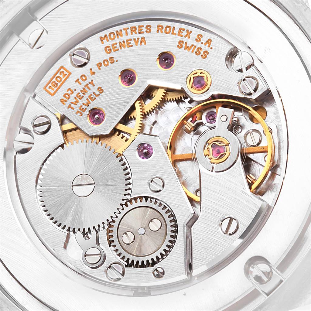 This image shows a close-up view of the mechanical movement inside a Rolex Cellini 4233 Men
s White Gold White Dial 4233 Men
s White Gold White Dial watch, including gears and jewels.
