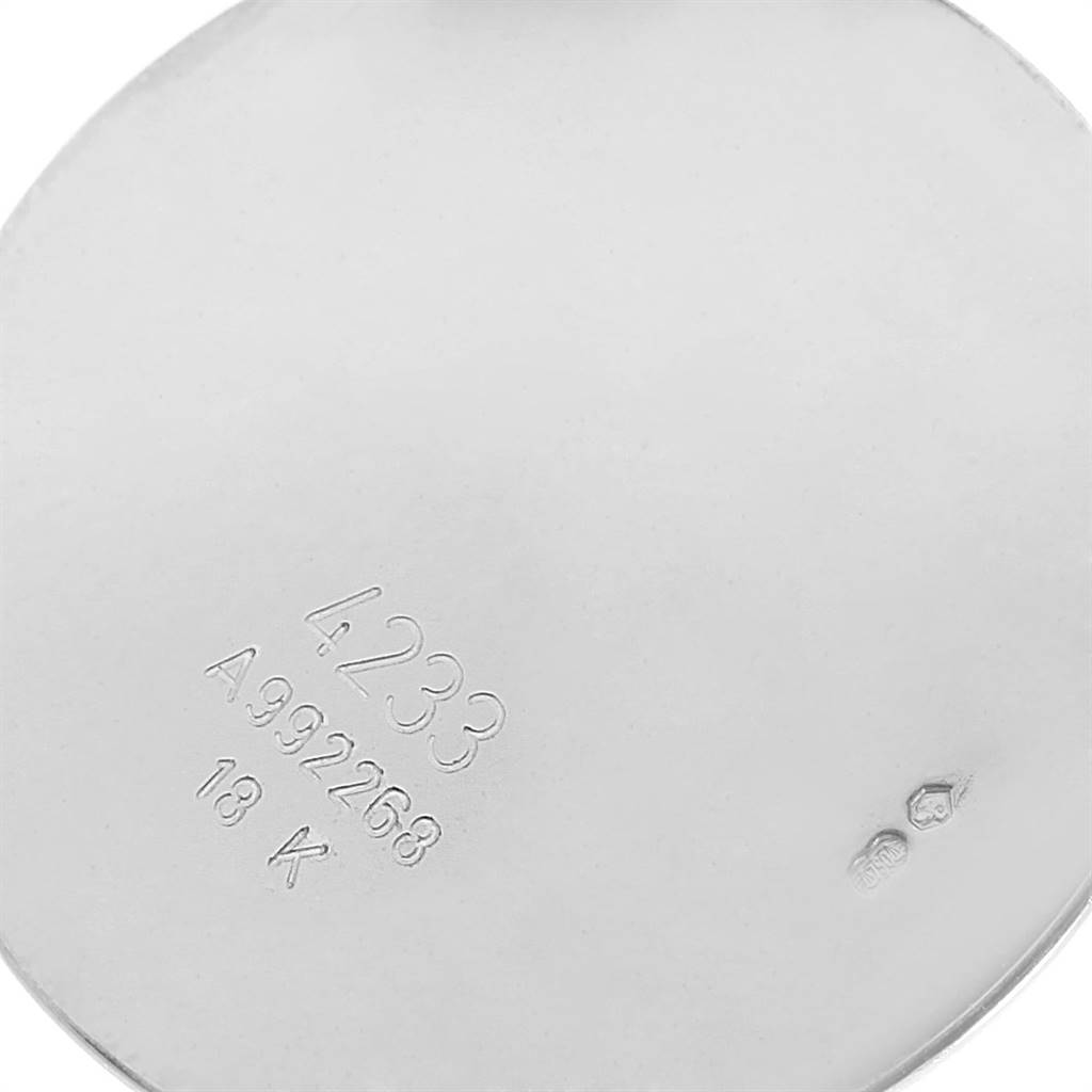 This image shows a close-up of the back case interior of a Rolex Cellini 4233 Men
s White Gold White Dial 4233 Men
s White Gold White Dial watch, displaying the model number, serial number, and 18K gold stamp. 