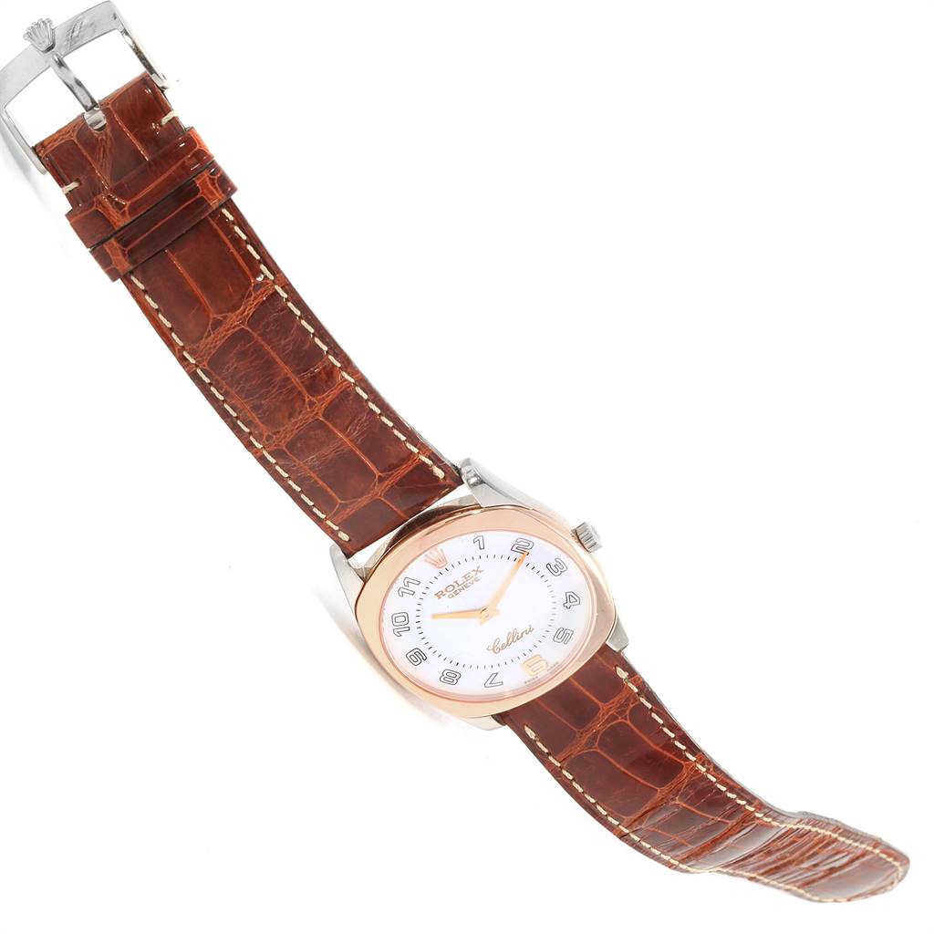 The Rolex Cellini 4233 Men
s White Gold White Dial 4233 Men
s White Gold White Dial watch is shown at an angled side view, highlighting its leather strap, watch face, and buckle.