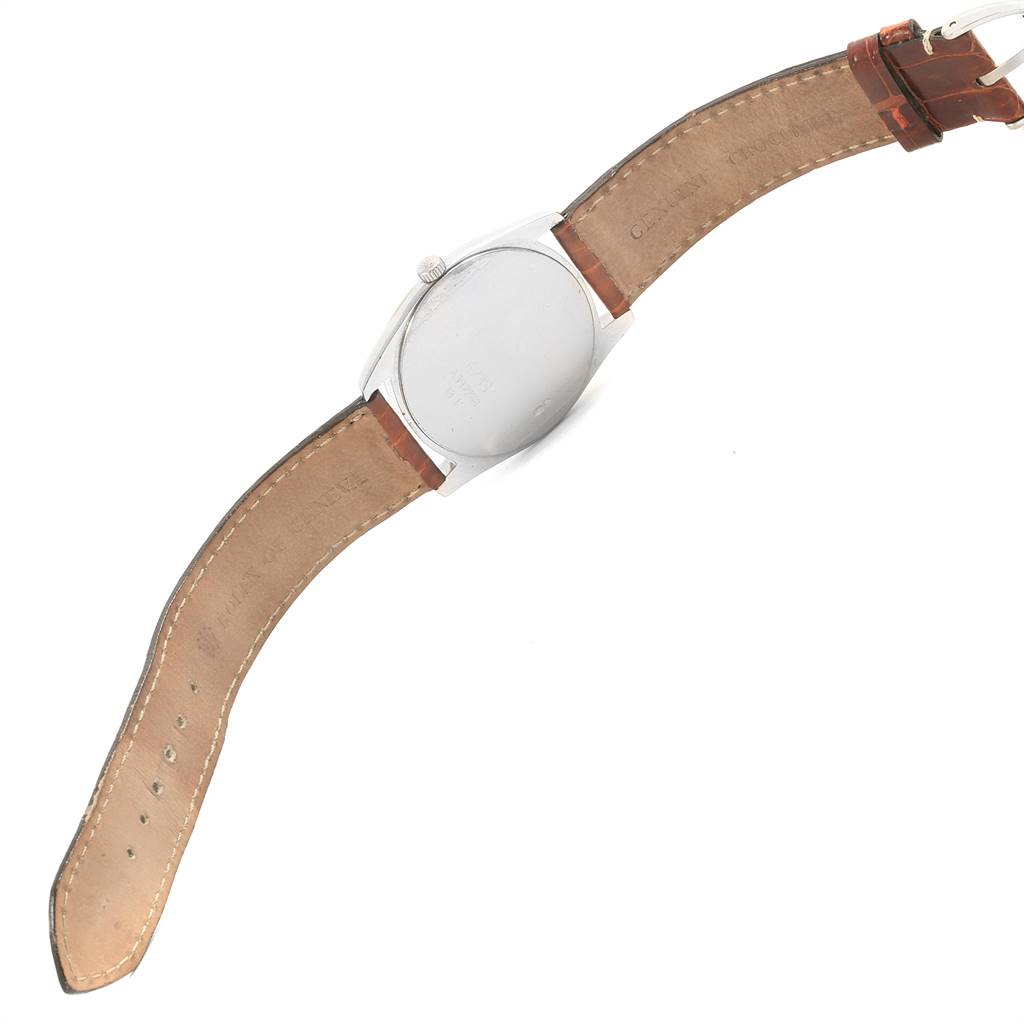 The image shows the back of a Rolex Cellini 4233 Men
s White Gold White Dial 4233 Men
s White Gold White Dial watch with a brown leather strap, captured from a rear angle.