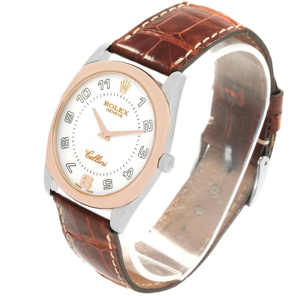 The image shows a Rolex Cellini 4233 Men
s White Gold White Dial 4233 Men
s White Gold White Dial watch at a three-quarter angle, highlighting its face, bezel, and brown leather strap.