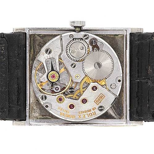 This image shows the internal mechanism of a Rolex Cellini 4014 White Gold Silver Dial 4014 White Gold Silver Dial watch, viewed from the back with the case opened.