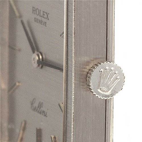 The image shows a close-up of the side view of a Rolex Cellini 4014 White Gold Silver Dial 4014 White Gold Silver Dial watch, focusing on the crown and part of the dial.
