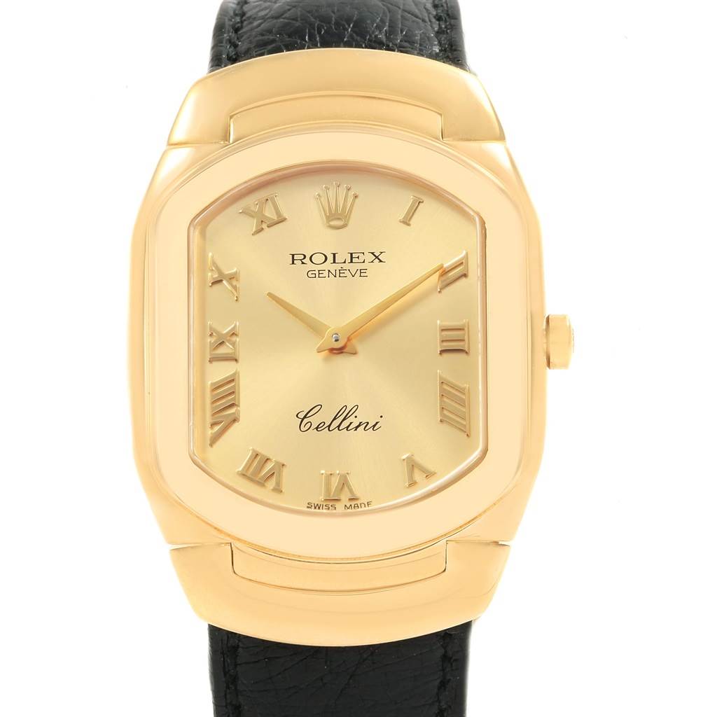 The Rolex Cellini 6633 Men's Yellow Gold Champagne Dial 6633 Men's Yellow Gold Champagne Dial watch is shown from the front, featuring a gold face, Roman numerals, and a black leather strap.
