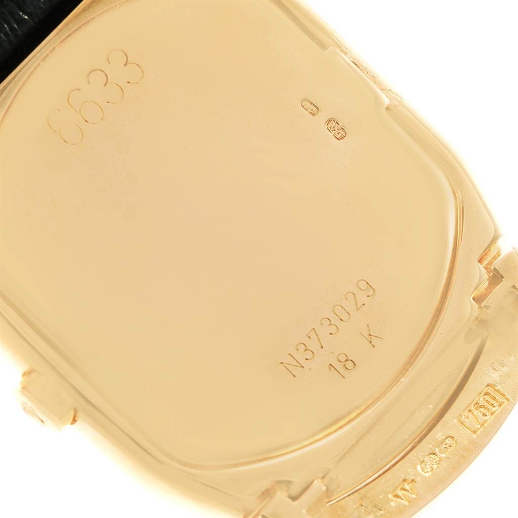 This image shows the back case of a Rolex Cellini 6633 Men's Yellow Gold Champagne Dial 6633 Men's Yellow Gold Champagne Dial watch, displaying the model number and 18K gold marking.