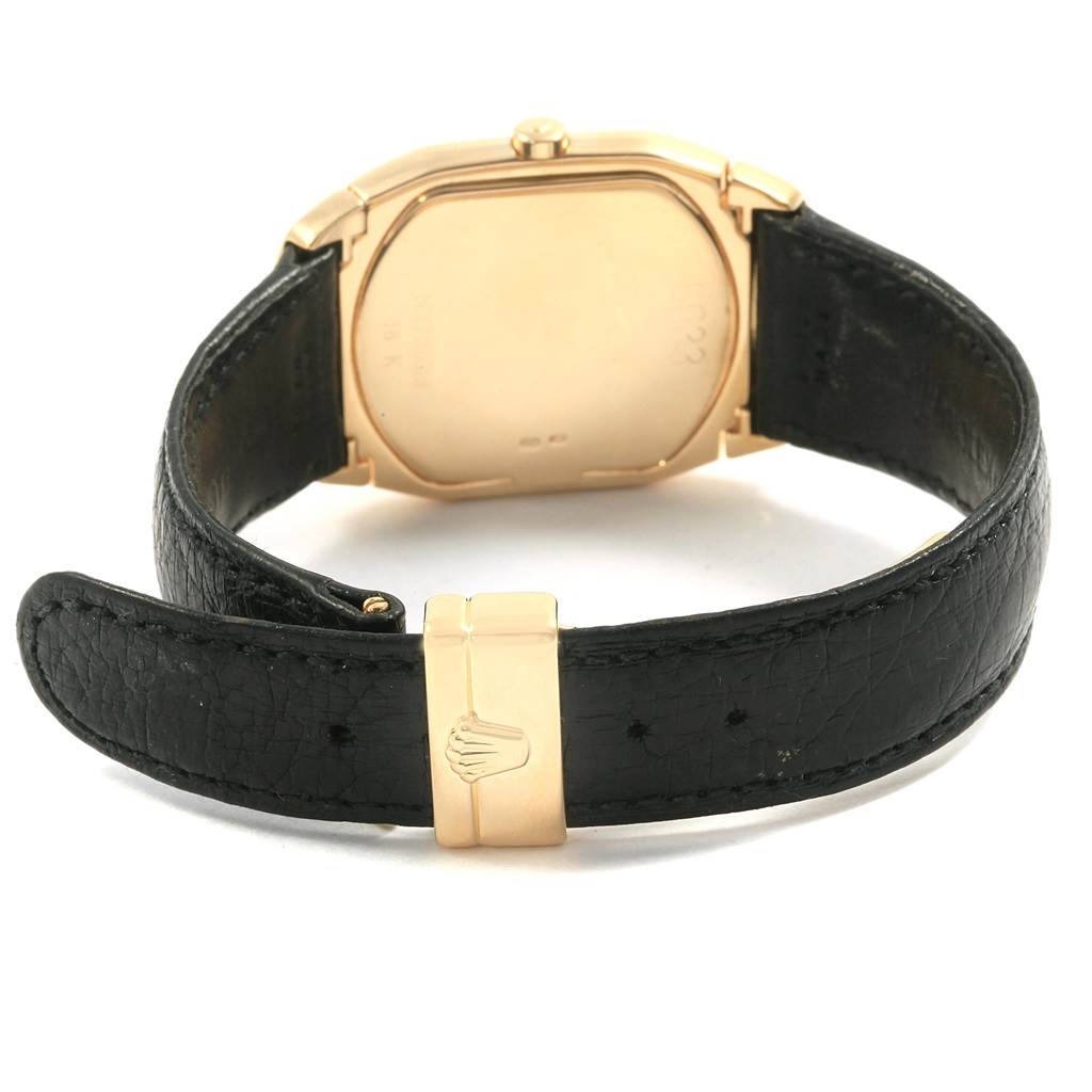 This image shows the back view of a Rolex Cellini 6633 Men's Yellow Gold Champagne Dial 6633 Men's Yellow Gold Champagne Dial watch, highlighting the black leather strap and gold clasp.