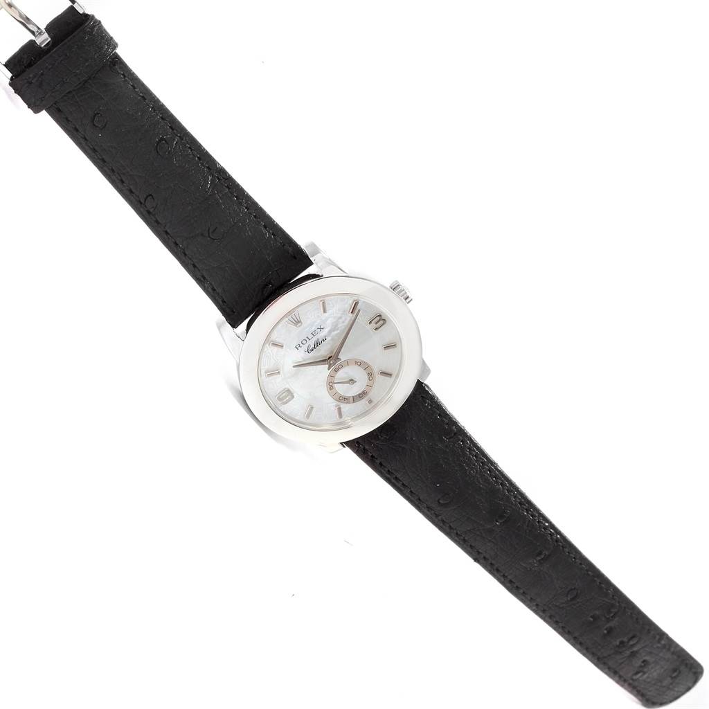 This Rolex Cellini 5240/9 Men's Platinum Mother of Pearl Dial 5240/9 Men's Platinum Mother of Pearl Dial watch is shown from a top-down angle, featuring its silver dial and black leather strap.
