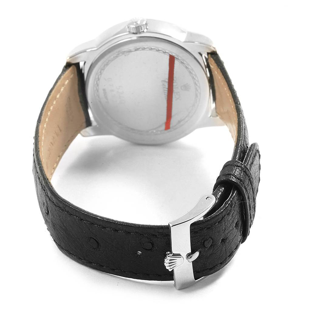 The image shows the back of the Rolex Cellini 5240/9 Men's Platinum Mother of Pearl Dial 5240/9 Men's Platinum Mother of Pearl Dial watch and its black leather strap with a clasp, viewed from an angle below.