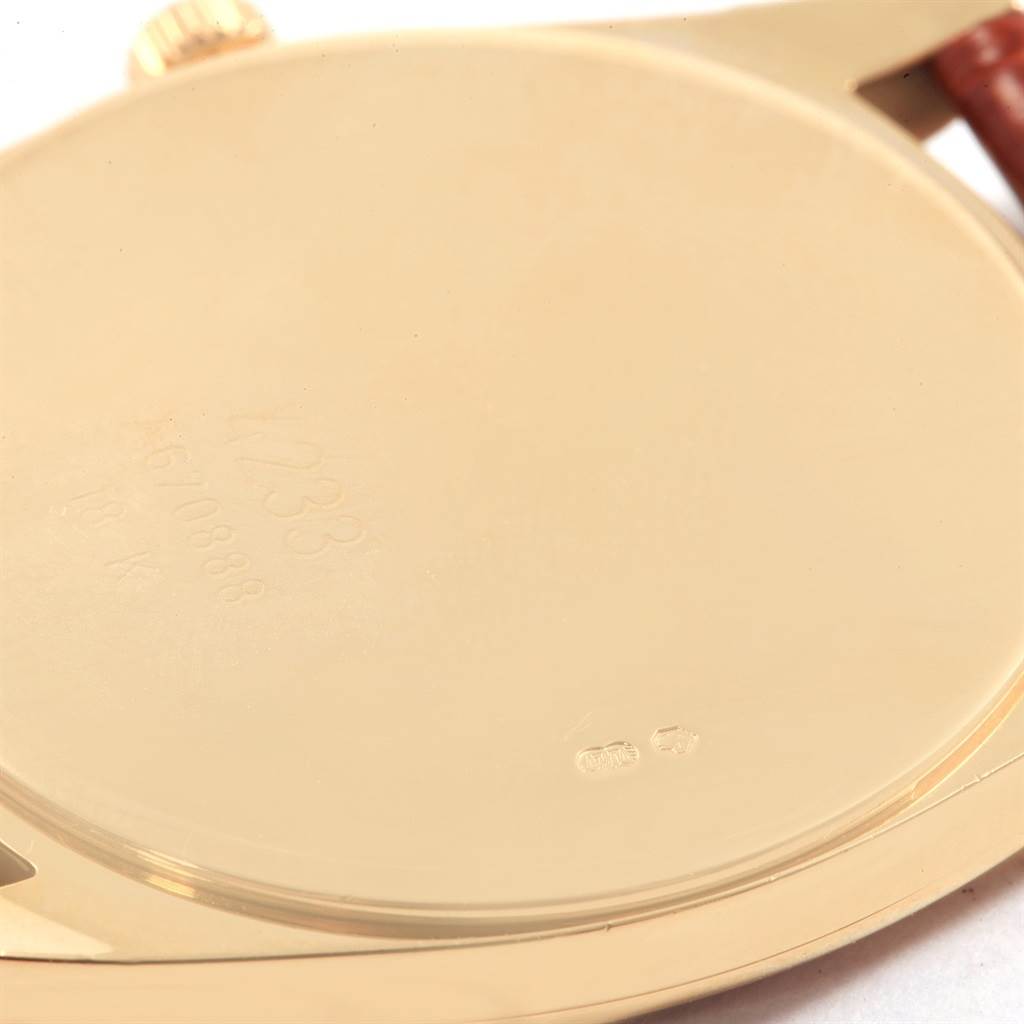 The image shows the back case and edge of the crown of a Rolex Cellini 4233 Men's Stainless Steel White Dial 4233 Men's Stainless Steel White Dial model watch.