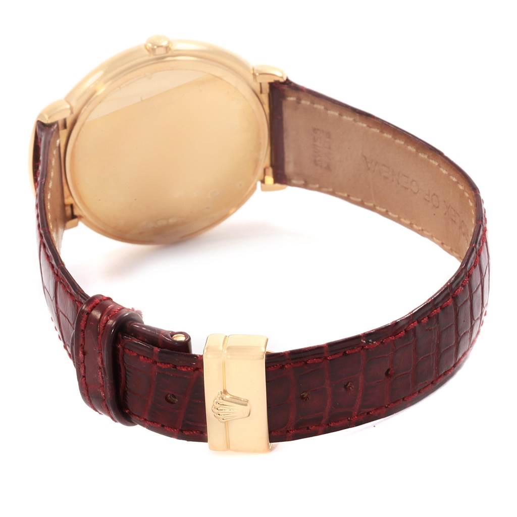 The image shows the back and strap of a Rolex Cellini 6623 Men's Yellow Gold White Dial 6623 Men's Yellow Gold White Dial watch, featuring a gold case and a brown leather band with a gold buckle.