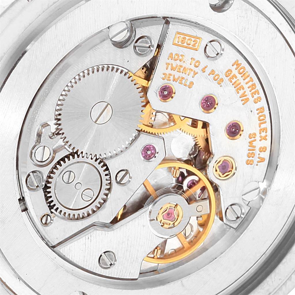 This close-up view shows the intricate inner mechanical movement of a Rolex Cellini 4233 Men's White Gold White Dial 4233 Men's White Gold White Dial watch.
