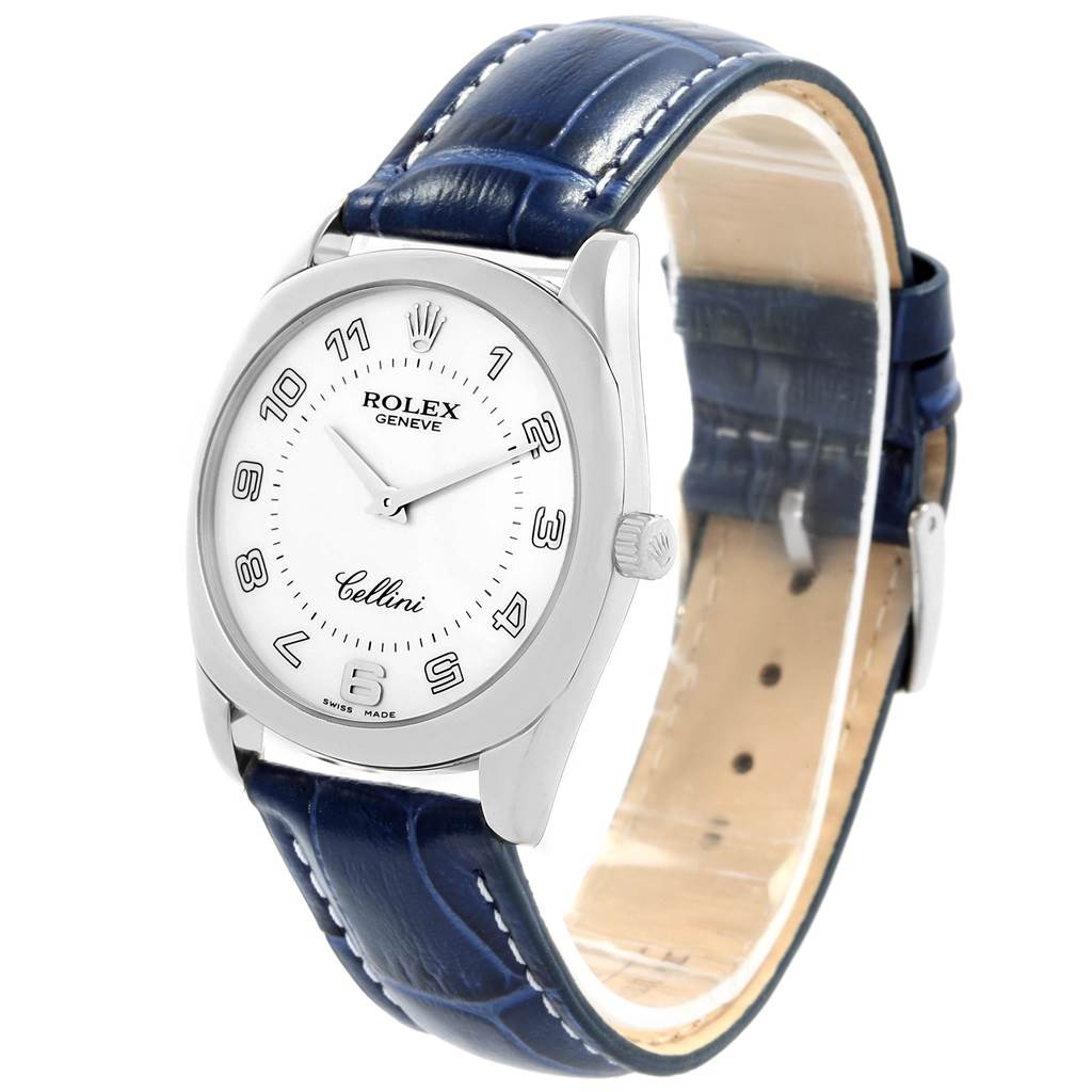 The watch is a Rolex Cellini 4233 Men's White Gold White Dial 4233 Men's White Gold White Dial model, shown at a slight front angle, displaying the face, crown, and blue leather strap.