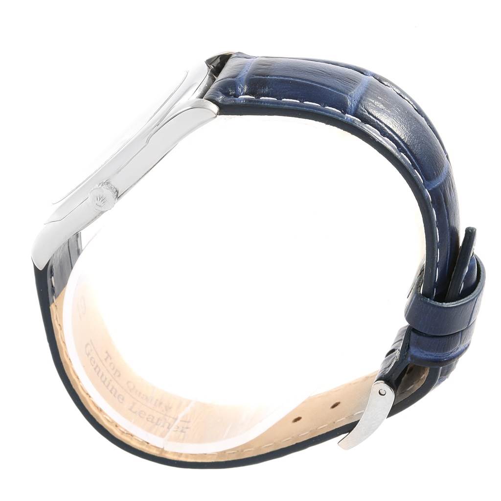 The image shows a side view of the Rolex Cellini 4233 Men's White Gold White Dial 4233 Men's White Gold White Dial watch, highlighting the blue leather strap and silver case.