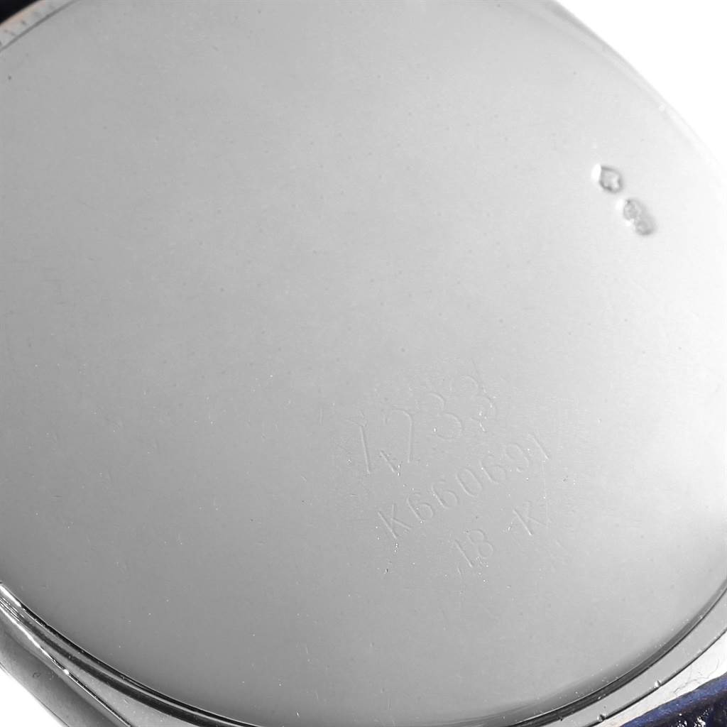 This image shows the back case of a Rolex Cellini 4233 Men's White Gold White Dial 4233 Men's White Gold White Dial watch, displaying engraved details.