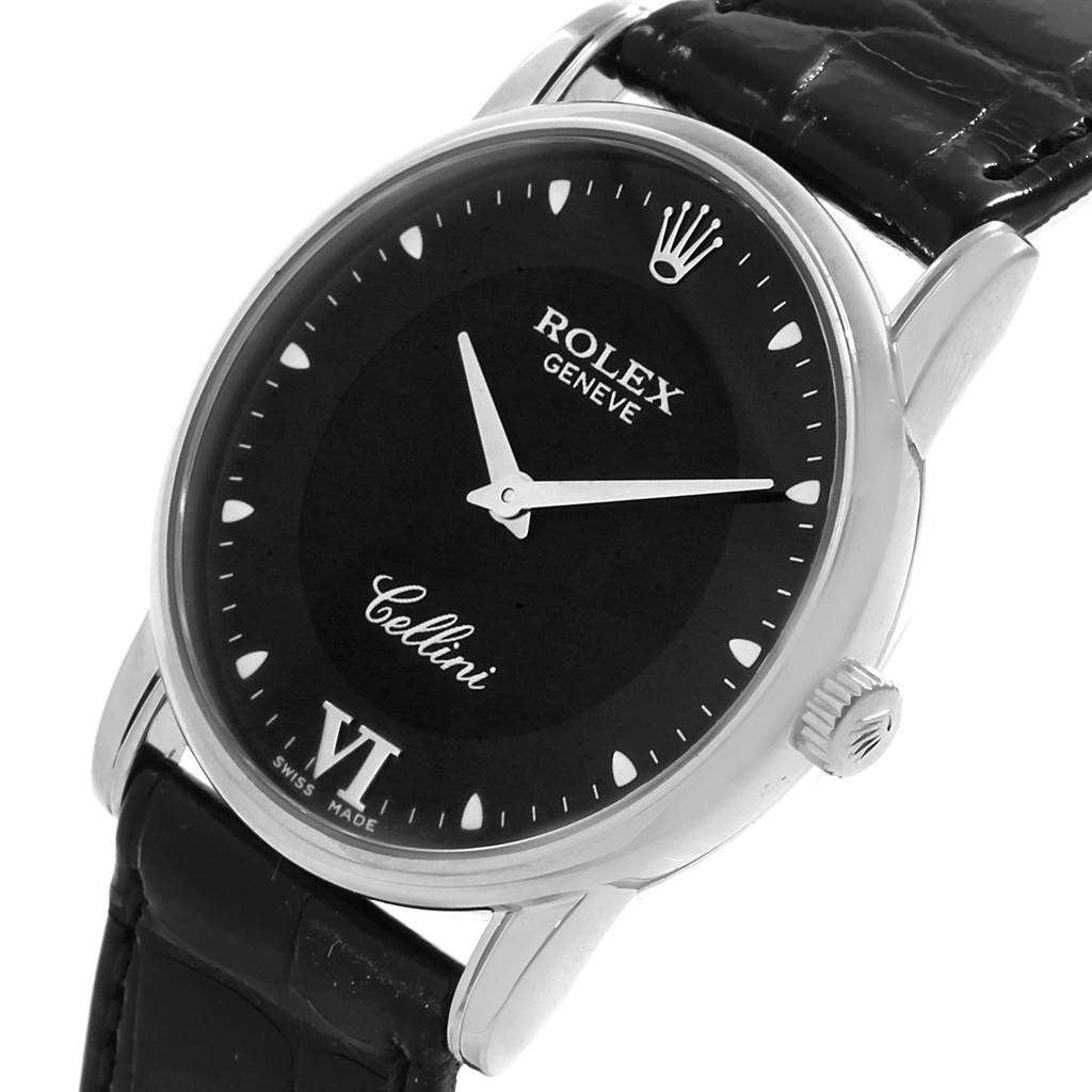 The image shows a close-up of the Rolex Cellini 5116 Men's White Gold Black Dial 5116 Men's White Gold Black Dial watch face, bezel, and crown, highlighting the black dial and leather strap.