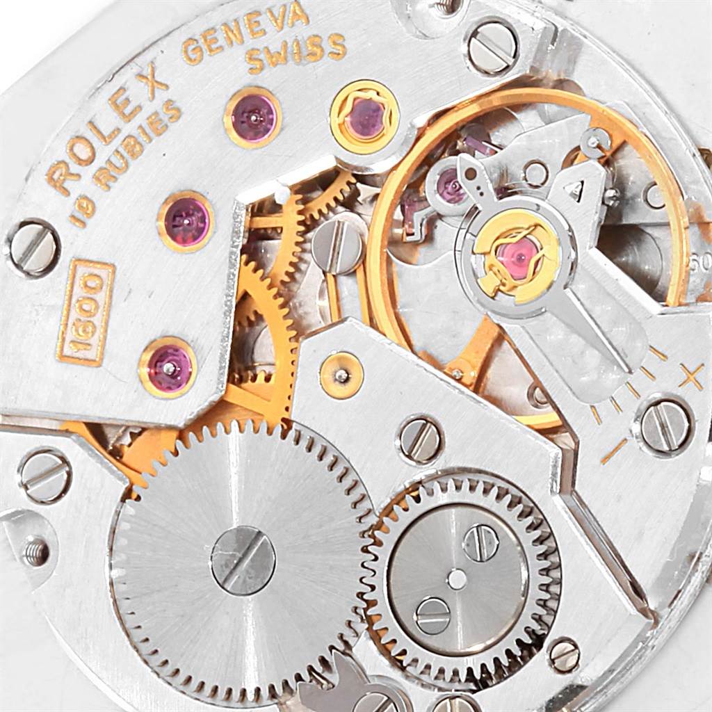 Close-up of the movement mechanism of a Rolex Cellini 4086 Men's White Gold Silver Dial 4086 Men's White Gold Silver Dial watch, showcasing gears, jewels, and intricate inner workings.