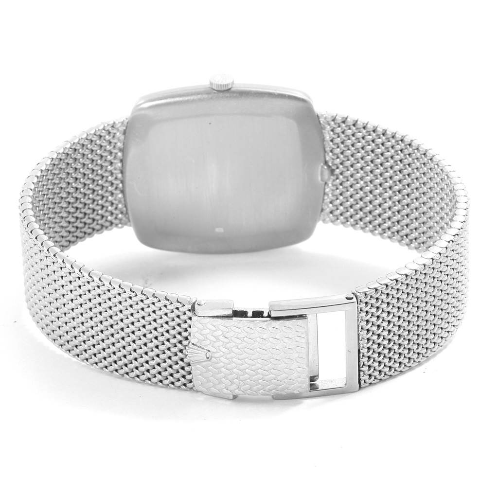 The image shows the back view of a Rolex Cellini 4086 Men's White Gold Silver Dial 4086 Men's White Gold Silver Dial watch, highlighting its case, crown, and mesh bracelet with the clasp.