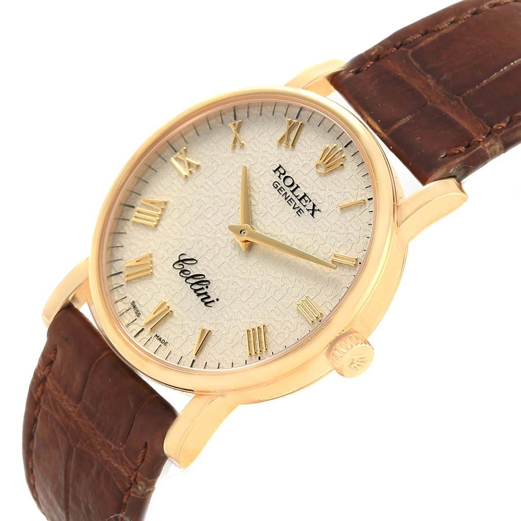 The Rolex Cellini 5115 Men's Beige Dial 5115 Men's Beige Dial watch is shown from a slightly angled top view, displaying the dial, hour markers, hands, and part of the leather strap.