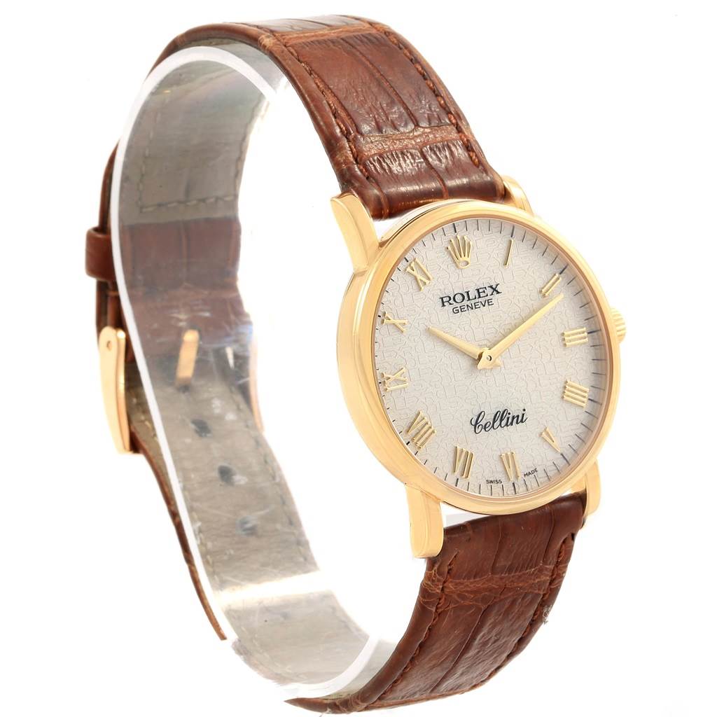 The image shows a Rolex Cellini 5115 Men's Beige Dial 5115 Men's Beige Dial watch from a side angle, highlighting its brown leather strap, gold case, and white dial.