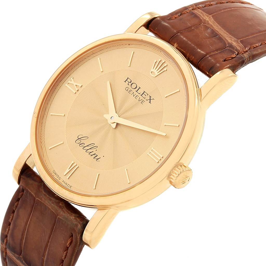 The image shows a frontal angle of a Rolex Cellini 5115 Men
s Yellow Gold Champagne Dial 5115 Men
s Yellow Gold Champagne Dial watch, displaying its dial, hands, crown, and brown leather strap.