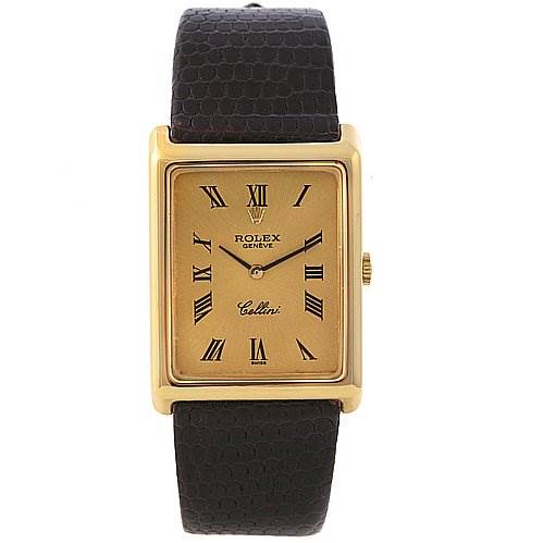 The image shows a front view of the Rolex Cellini 4105 Men's Yellow Gold Champagne Dial 4105 Men's Yellow Gold Champagne Dial watch, displaying its gold rectangular dial, Roman numerals, and black leather strap.