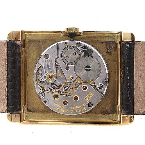 The image shows the back view of a Rolex Cellini 4105 Men's Yellow Gold Champagne Dial 4105 Men's Yellow Gold Champagne Dial watch, displaying its internal mechanical movement and components.