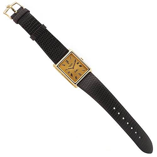 The Cellini model by Rolex is shown from a top-down angle, displaying the watch's face and entire leather strap.