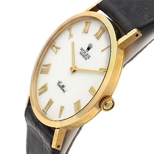 This image shows a side angle of a Rolex Cellini 4112 Men's Yellow Gold White Dial 4112 Men's Yellow Gold White Dial watch, focusing on the face, gold case, and black strap.
