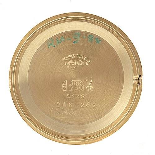 This image shows the inside of the case back of a Rolex Cellini 4112 Men's Yellow Gold White Dial 4112 Men's Yellow Gold White Dial watch, featuring various engravings and hallmarks.