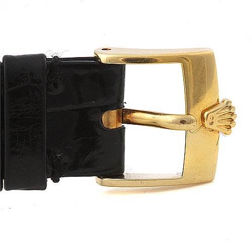 This image shows a close-up of the gold buckle on the strap of a Rolex Cellini 4112 Men's Yellow Gold White Dial 4112 Men's Yellow Gold White Dial watch.