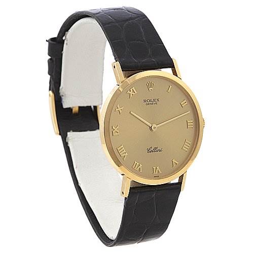This image shows a side view of the Rolex Cellini 4112 Men's Yellow Gold Champagne Dial 4112 Men's Yellow Gold Champagne Dial watch, highlighting its gold casing, black leather strap, and Roman numeral dial.