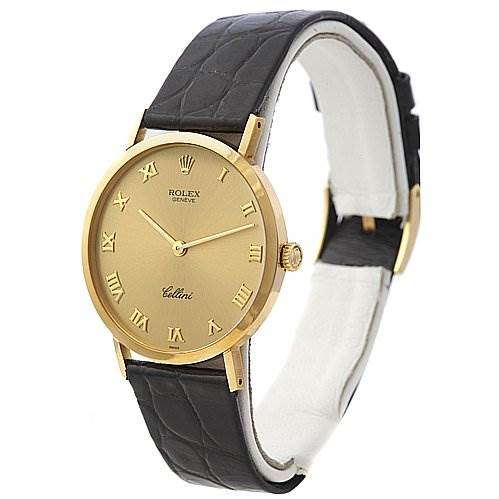 The image shows a side angle view of a Rolex Cellini 4112 Men's Yellow Gold Champagne Dial 4112 Men's Yellow Gold Champagne Dial watch, highlighting its gold dial, Roman numerals, and leather strap.