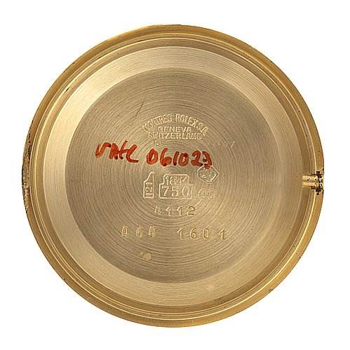 This image shows the inside of the case back for a Rolex Cellini 4112 Men's Yellow Gold Champagne Dial 4112 Men's Yellow Gold Champagne Dial watch, displaying markings and inscriptions.