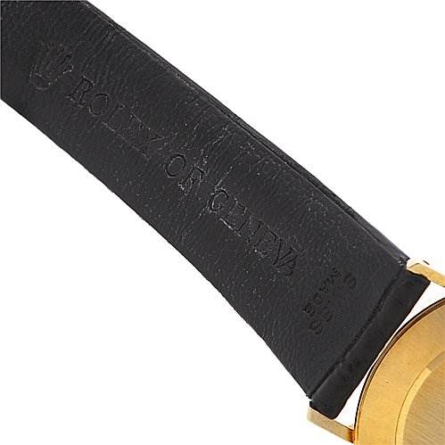 The image shows the strap and partial gold case of a Rolex Cellini 4112 Men's Yellow Gold Champagne Dial 4112 Men's Yellow Gold Champagne Dial watch from an angled close-up view.