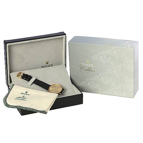 The image shows a Rolex Cellini 4112 Men's Yellow Gold Champagne Dial 4112 Men's Yellow Gold Champagne Dial watch at a slightly top-down angle, boxed with a pouch and outer packaging.