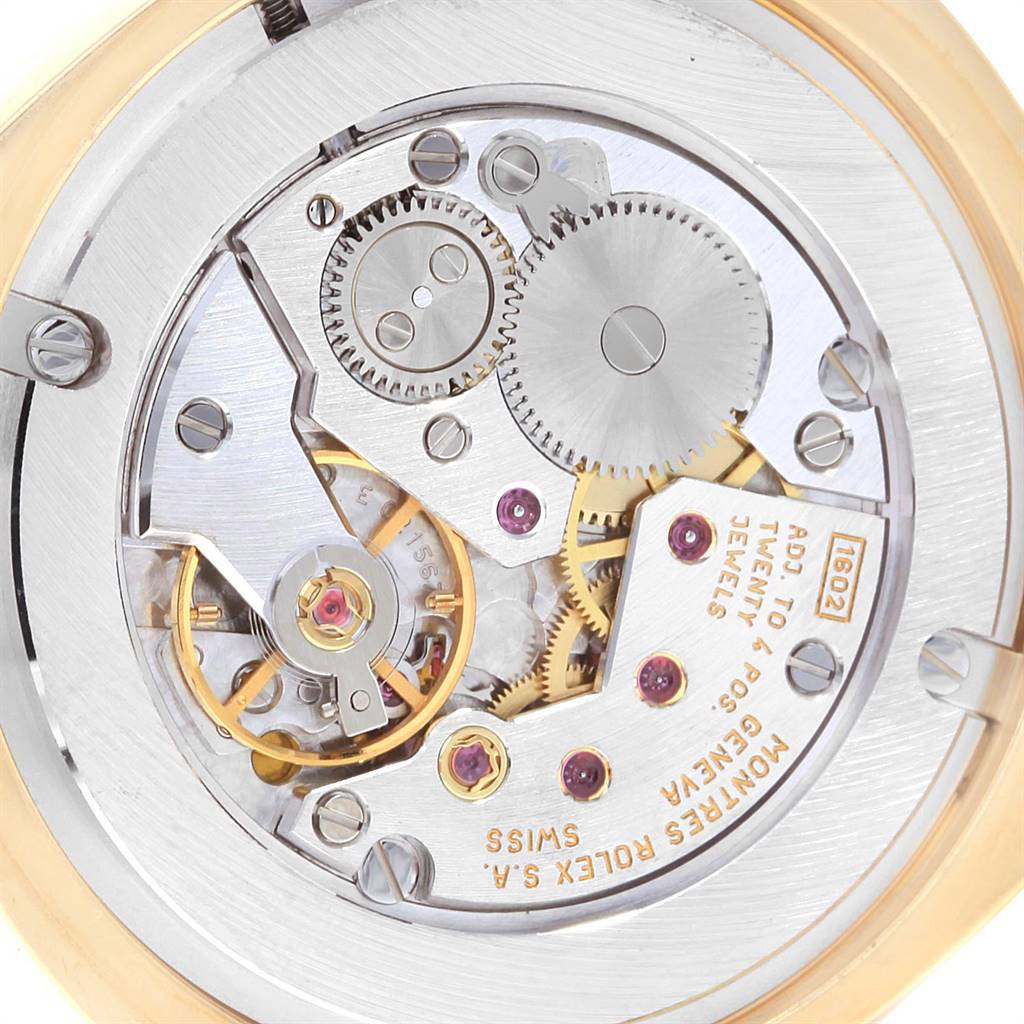 This image shows the intricate movement and internal mechanisms of the Rolex Cellini 4233 Men's Yellow Gold White Dial 4233 Men's Yellow Gold White Dial watch from a close-up angle.