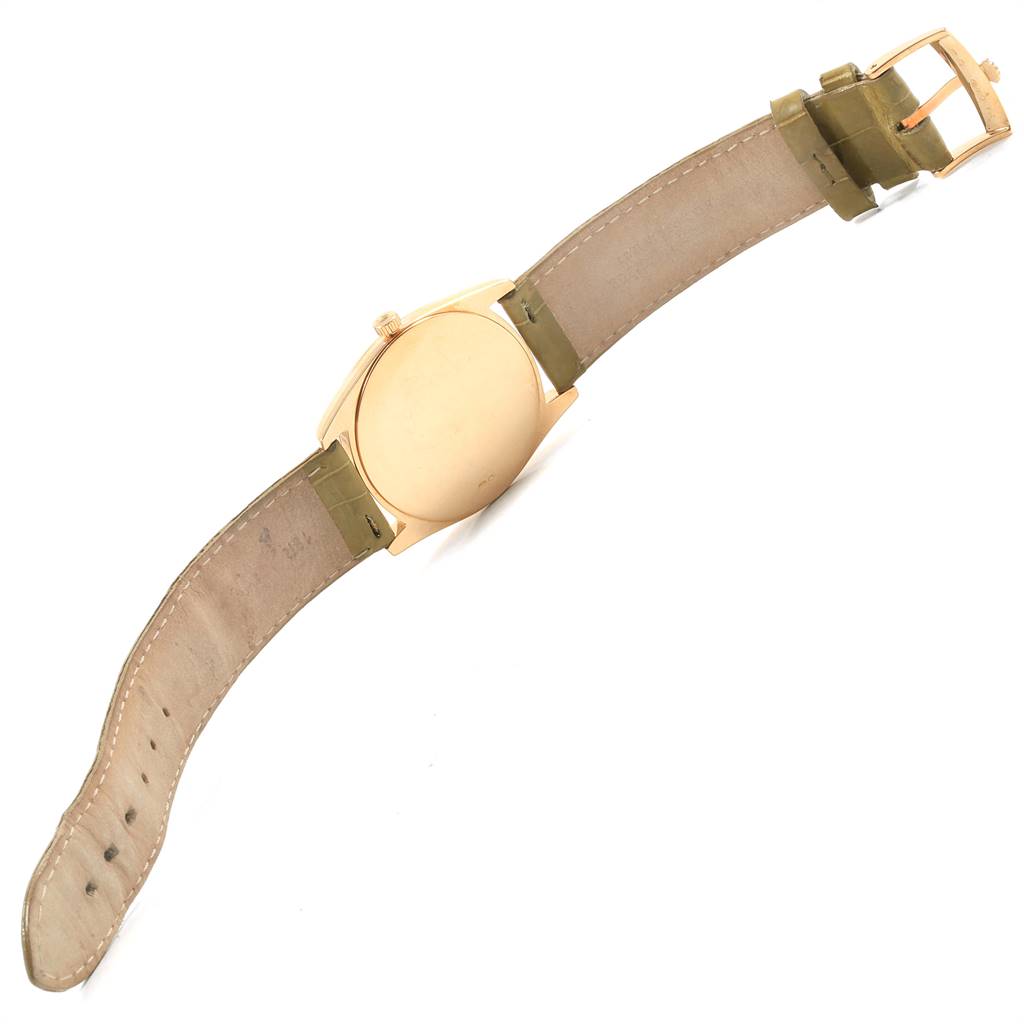 The image shows the back of a Rolex Cellini 4233 Men's Yellow Gold White Dial 4233 Men's Yellow Gold White Dial watch, with the leather strap fully extended.