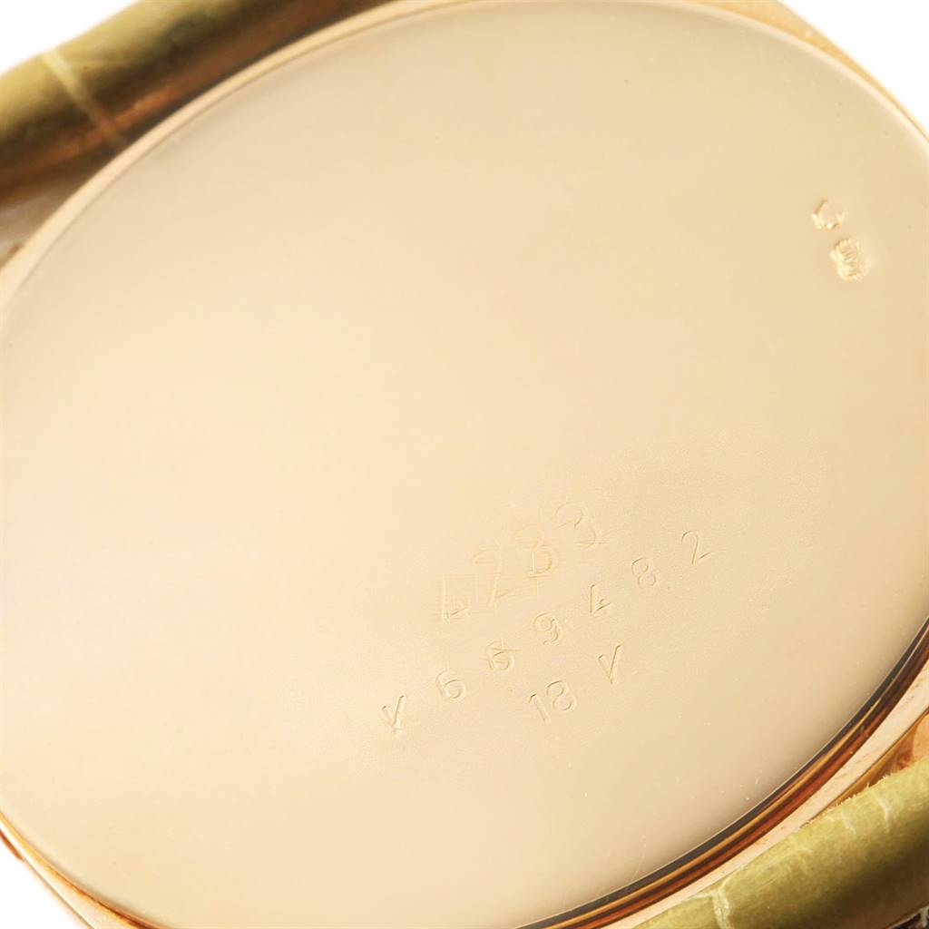 The image shows the back case of a Rolex Cellini 4233 Men's Yellow Gold White Dial 4233 Men's Yellow Gold White Dial watch, focusing on the watch's serial and model numbers.