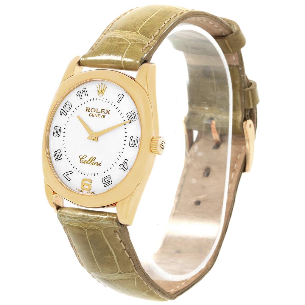 The Rolex Cellini 4233 Men's Yellow Gold White Dial 4233 Men's Yellow Gold White Dial watch is shown at a slight angle, displaying its face, crown, and part of its leather strap.