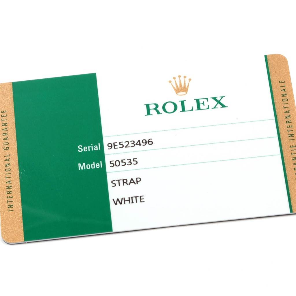 This is an international guarantee card for a Rolex Cellini 50535 Men's Rose Gold White Dial 50535 Men's Rose Gold White Dial model 50535 with a white strap, viewed from an angle showing both sides.