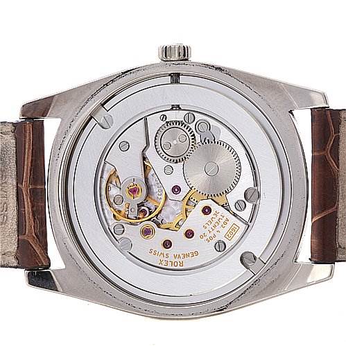 This image shows the back view of a Rolex Cellini 4233 Men's White Gold Black Dial 4233 Men's White Gold Black Dial watch, displaying its intricate internal mechanical movement.